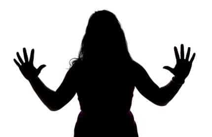 Image of woman's silhouette with open hands